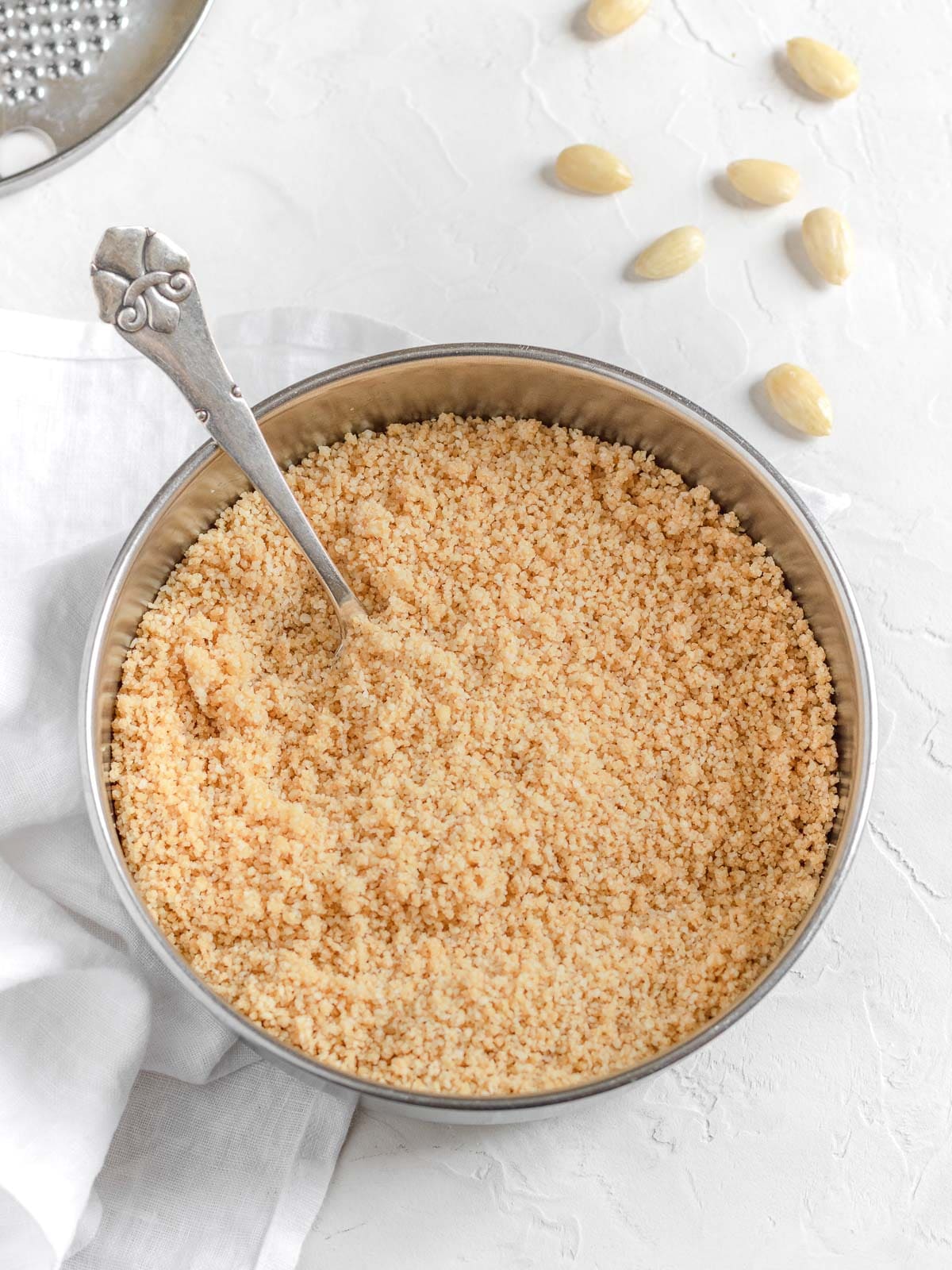 vegan parmesan cheese in a bowl ready to be used as topping