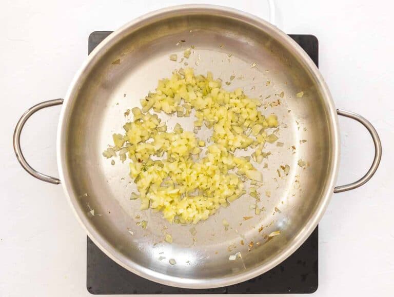 gently frying onion and garlic in oil