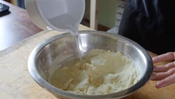 mixing water and semolina flour