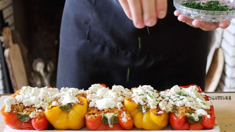 topping the peppers with vegan ricotta