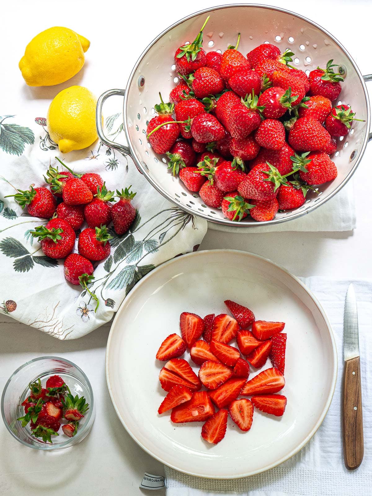 strawberries rinsed and cut in a strainer