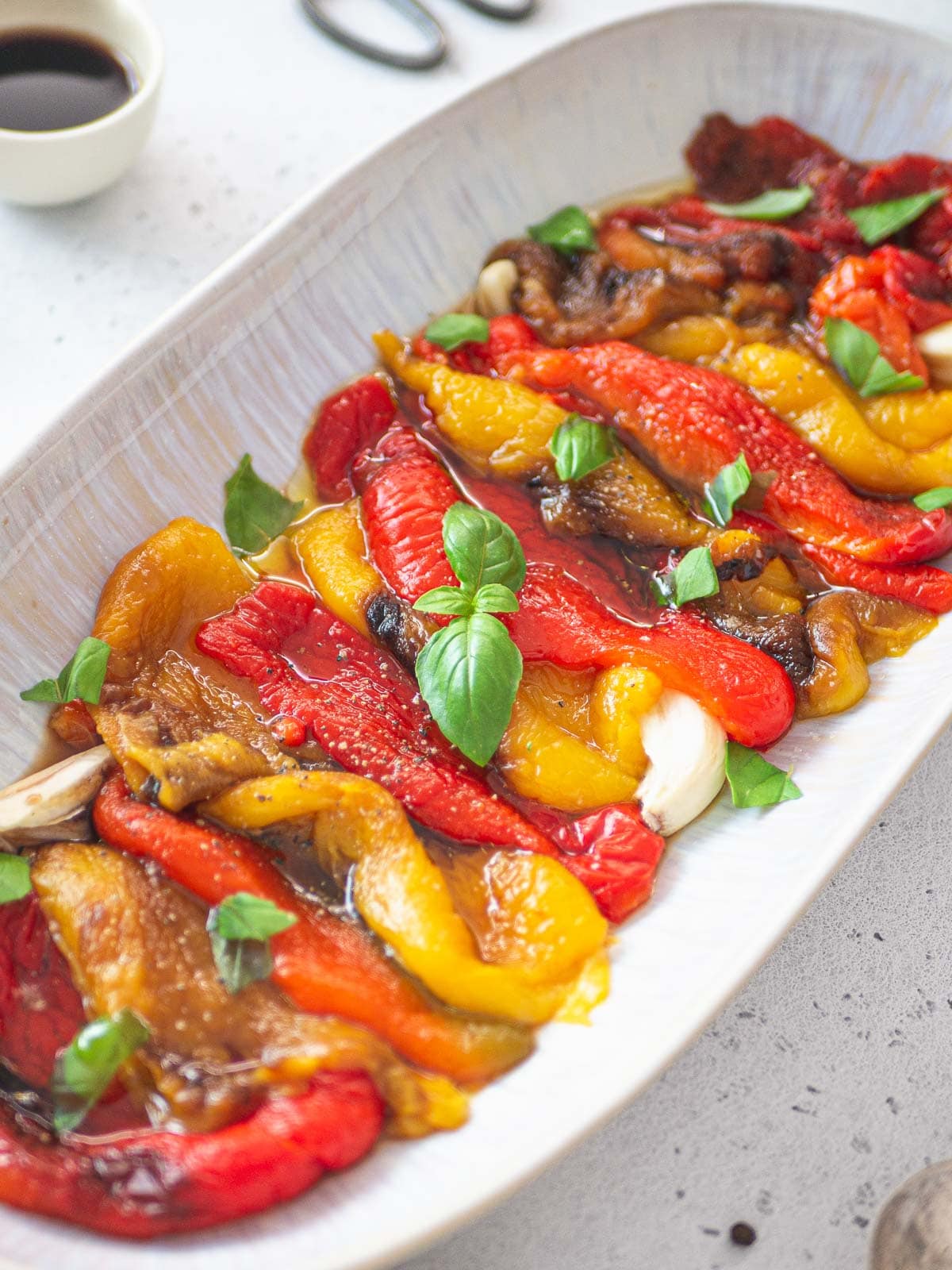 close up platter with roasted red and yellow peppers