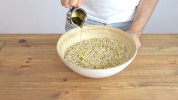 Adding olive oil to the barley