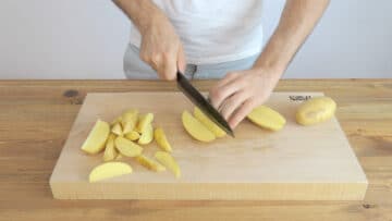 Cutting the potatoes into wedges