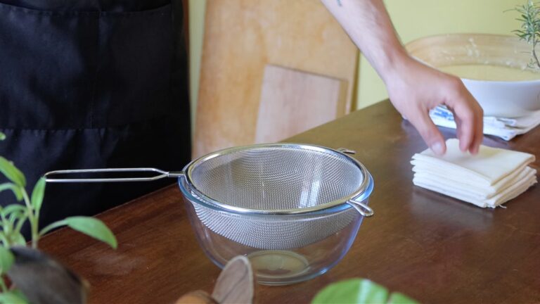 strainer on top of a bowl