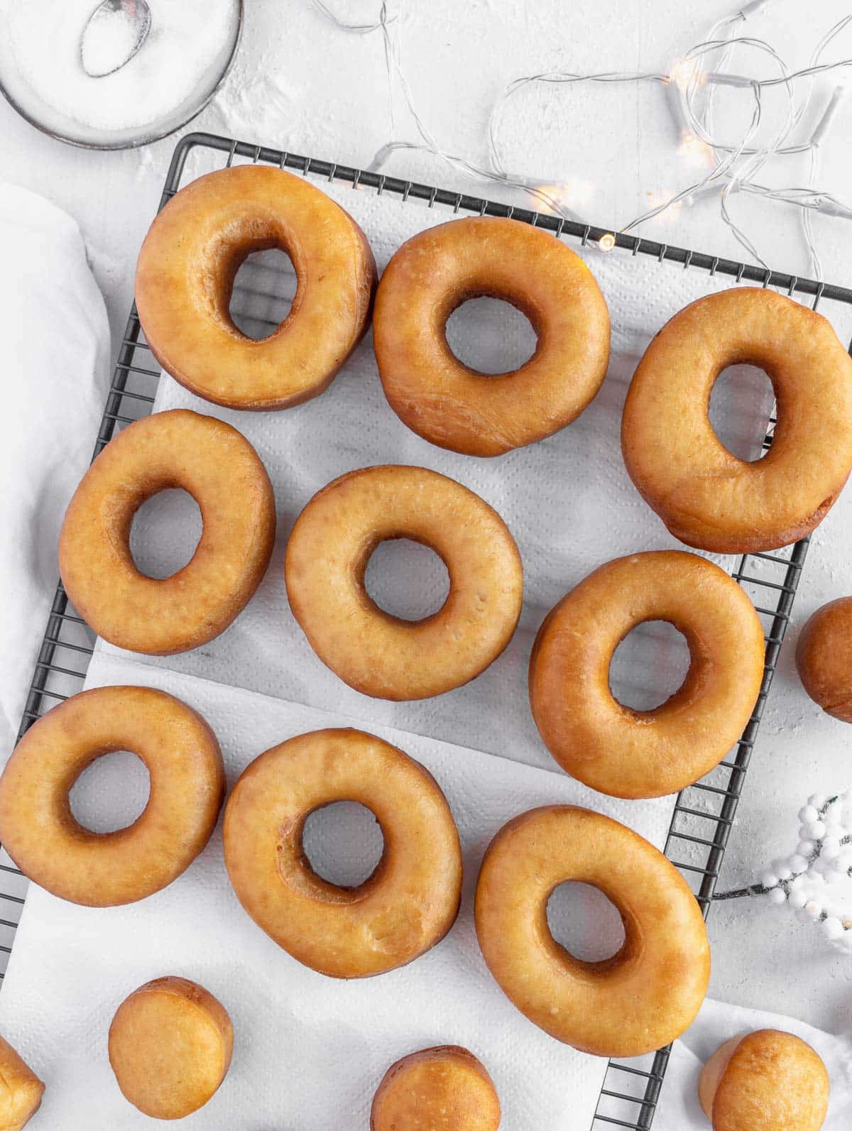 deep-fried vegan donuts on a cooling rack