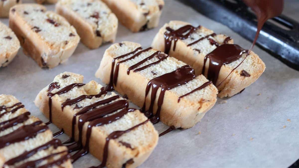 drizzling biscotti with melted chocolate