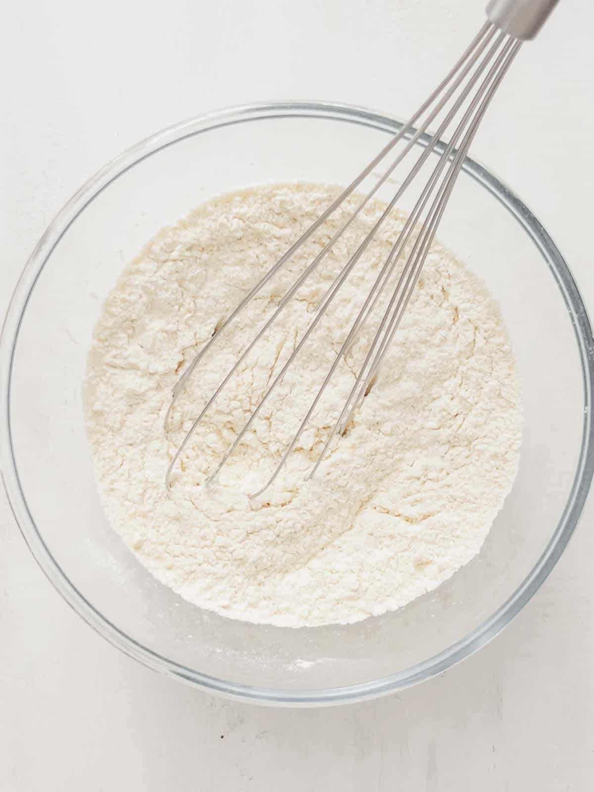 flour, sugar, and baking powder in a bowl