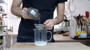 Soy milk, lemon and salt in a tall container