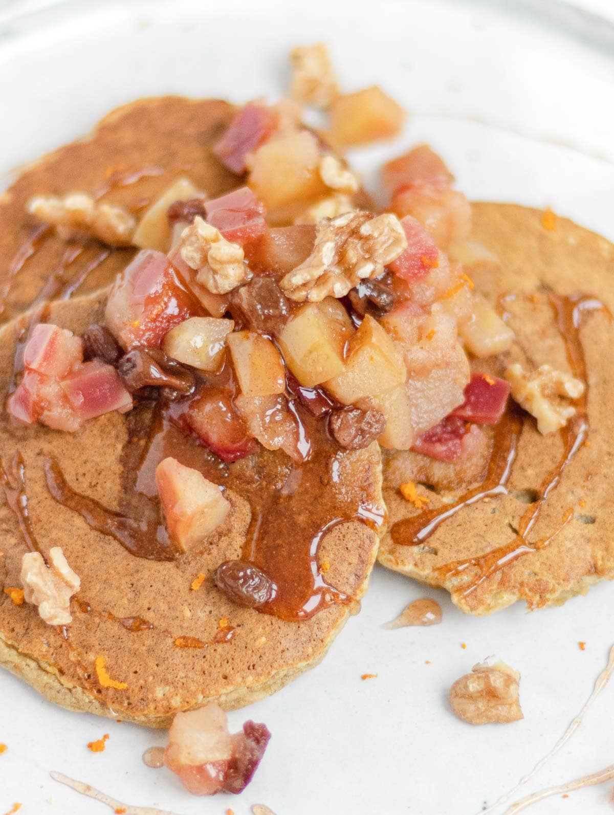 close up vegan oat pancakes with apples