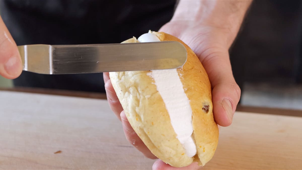 removing excess cream with a spatula