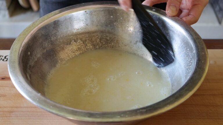 adding the wet ingredients to a bowl