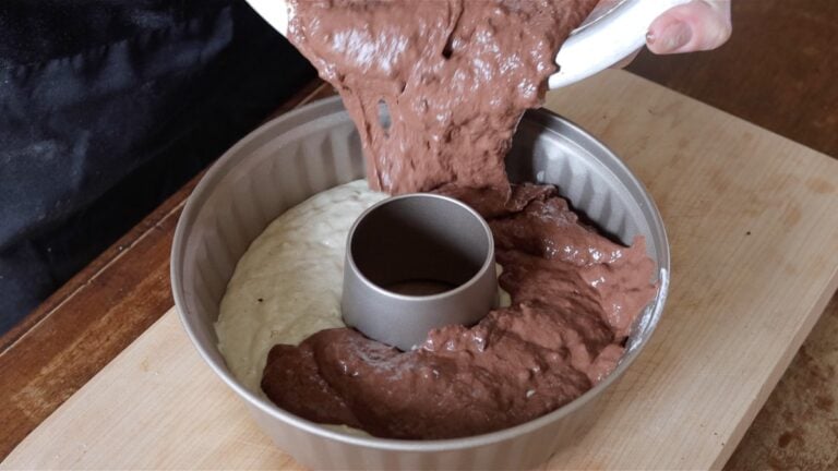 adding the chocolate batter to the pan