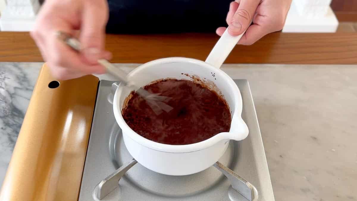 melting the cacao powder in hot water