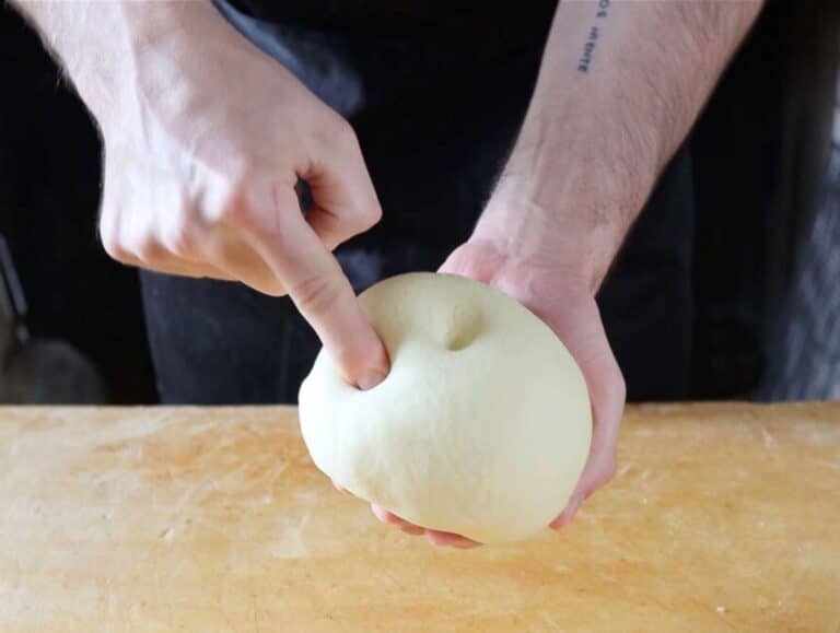 Step 2 Kneading trofie pasta dough until smooth compact and elastic on wooden board.