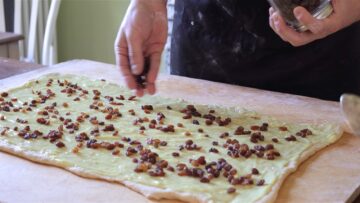 custard and raisins on top of the dough