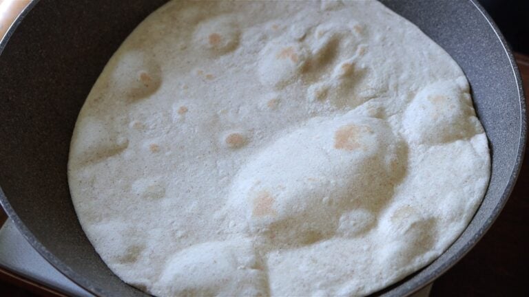 cooking the piadina on a hot pan