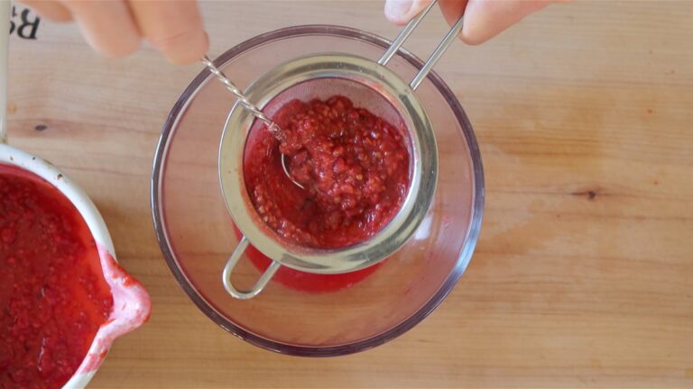 passing the raspberry syrup through a sieve