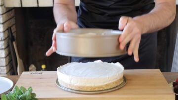 taking the vegan cheesecake out of the form