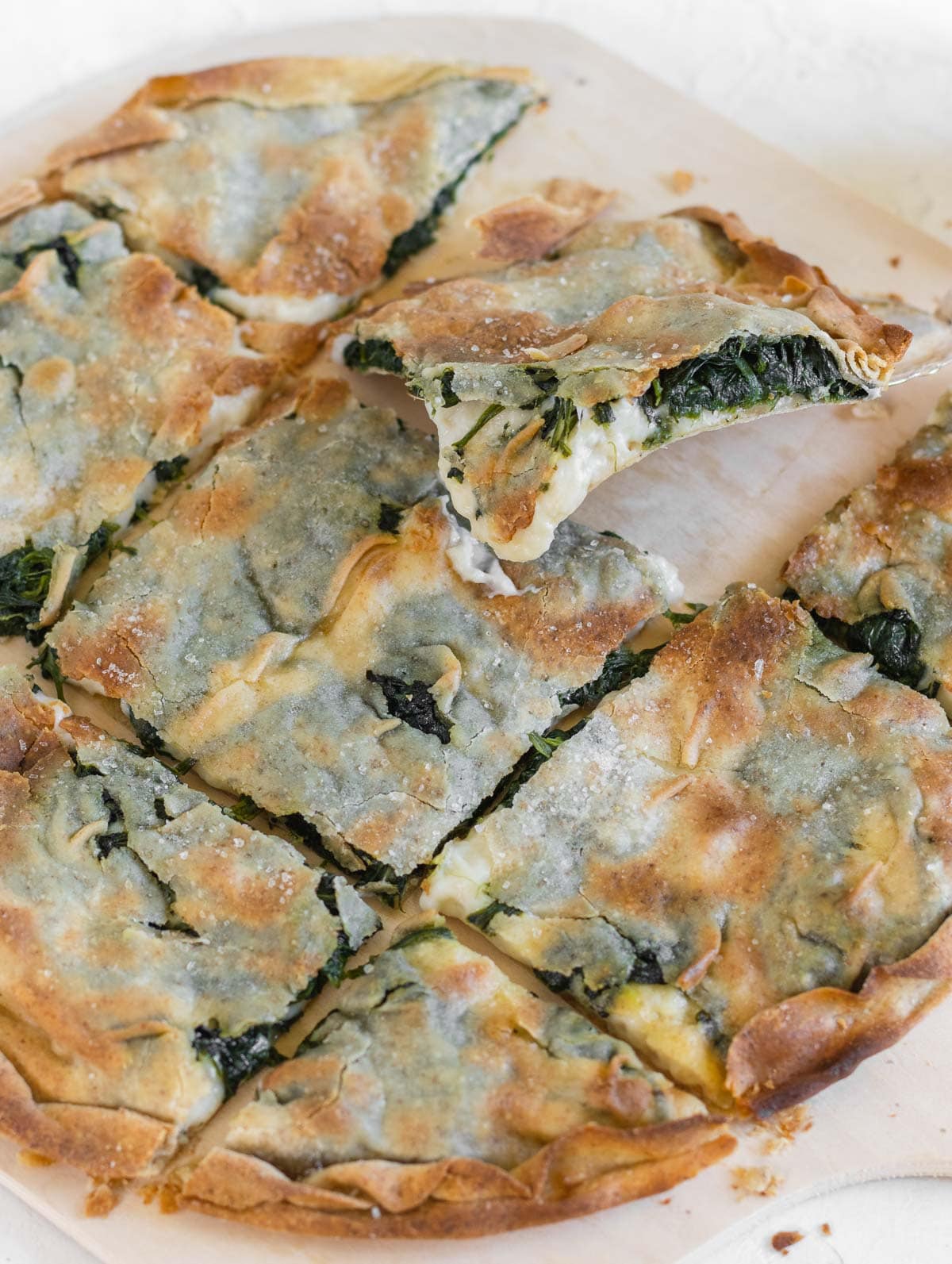 crisp focaccia with vegan melted cheese and spinach