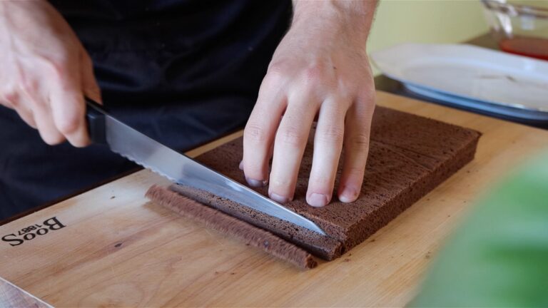 cutting the chocolate sponge cake