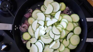 cooking the zucchini and the onion