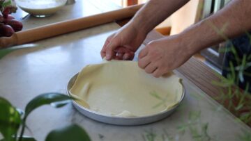 fitting the dough in the pie dish