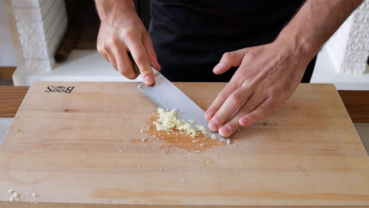 mashing garlic