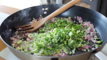 cooking the onion and the celery in a pan