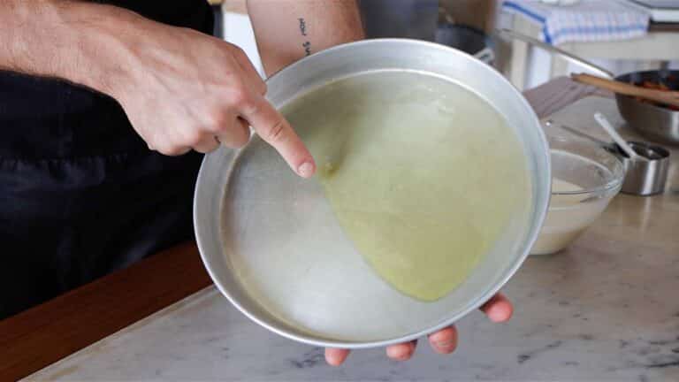 adding oil to a baking tray