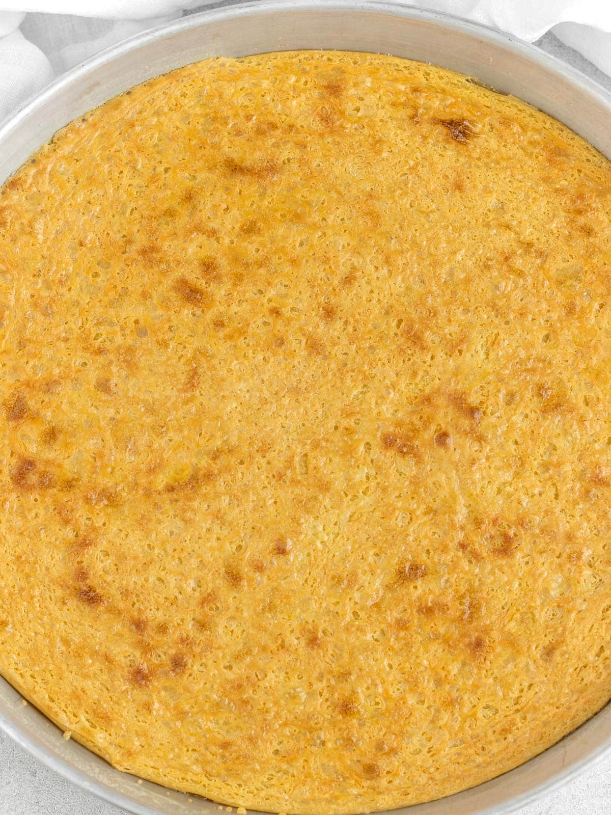farinata or socca in a baking tray