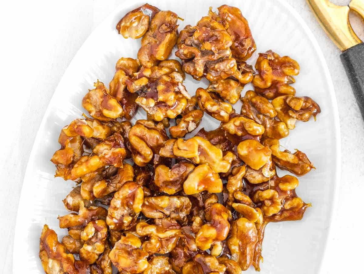 Candied walnuts on a white plate