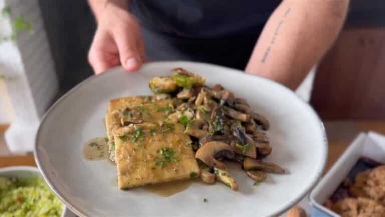 pan fried tofu with mushrooms on a plate