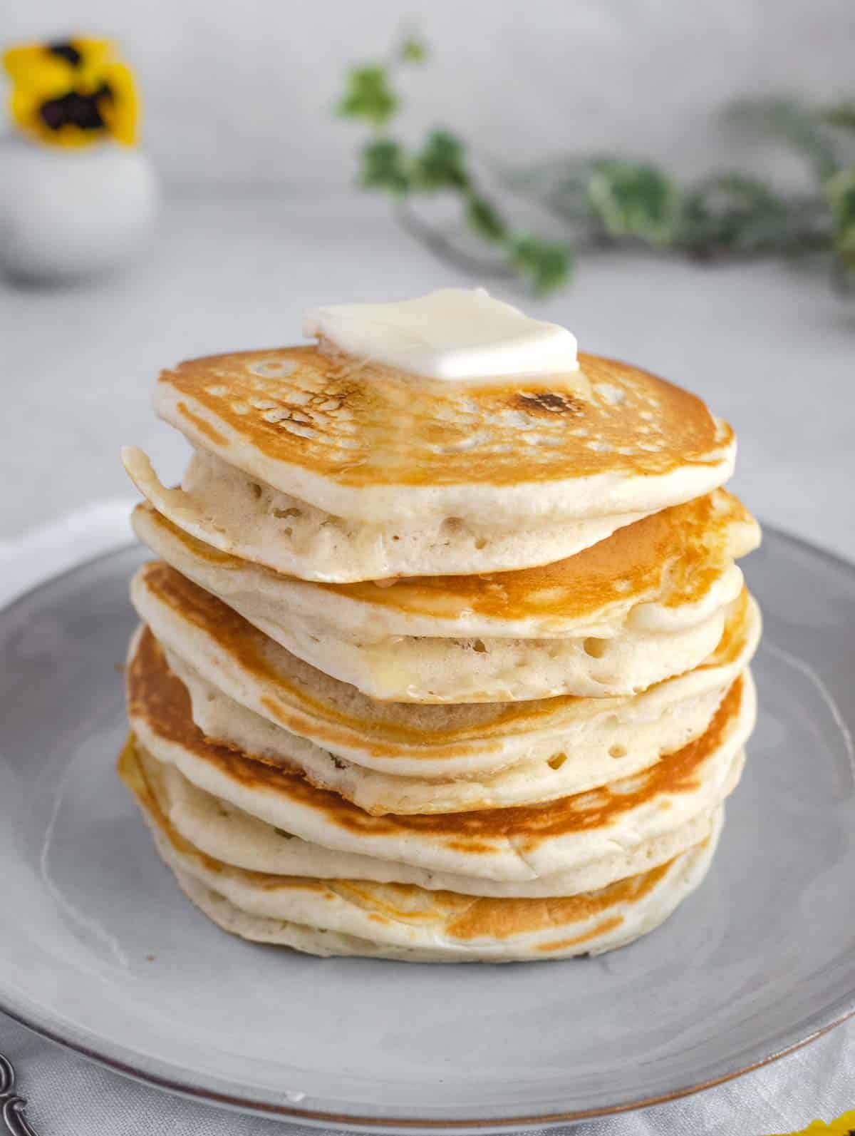 plain vegan pancakes with vegan butter on top