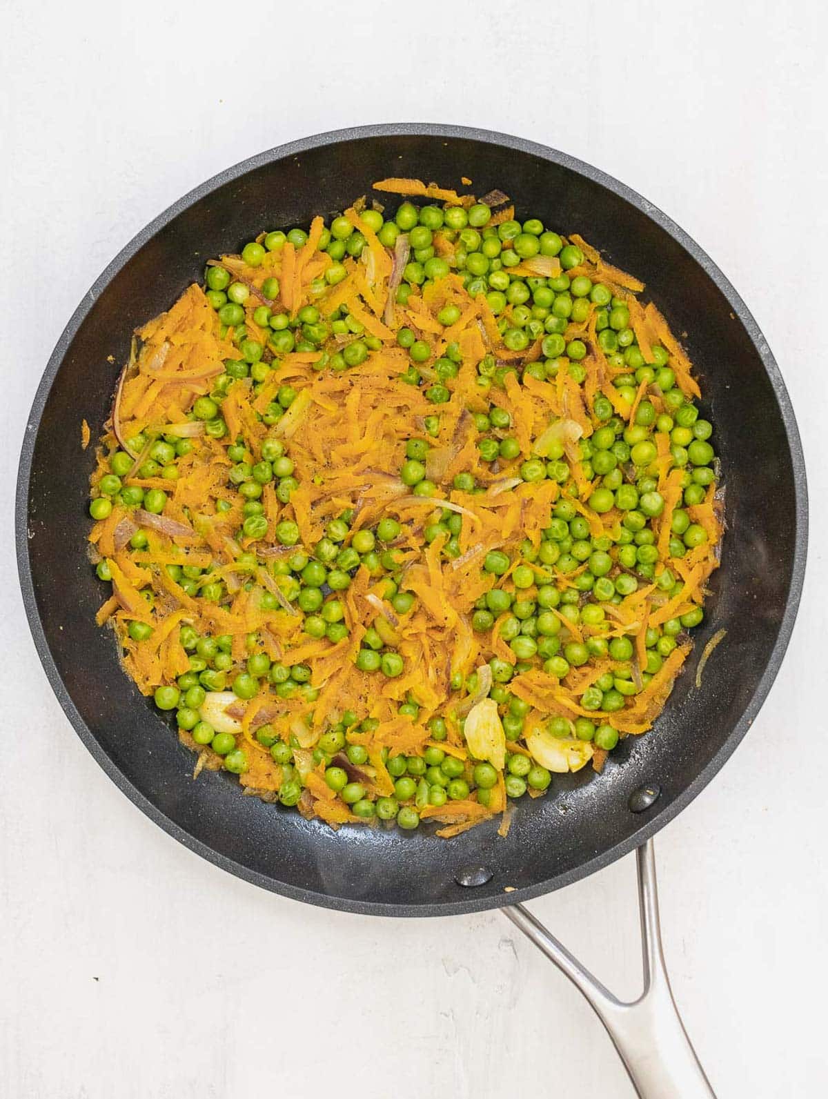 pea and carrot filling in a pan