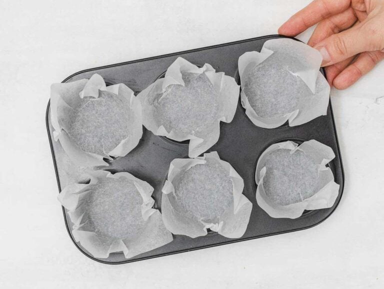 muffin pan lined with parchment paper