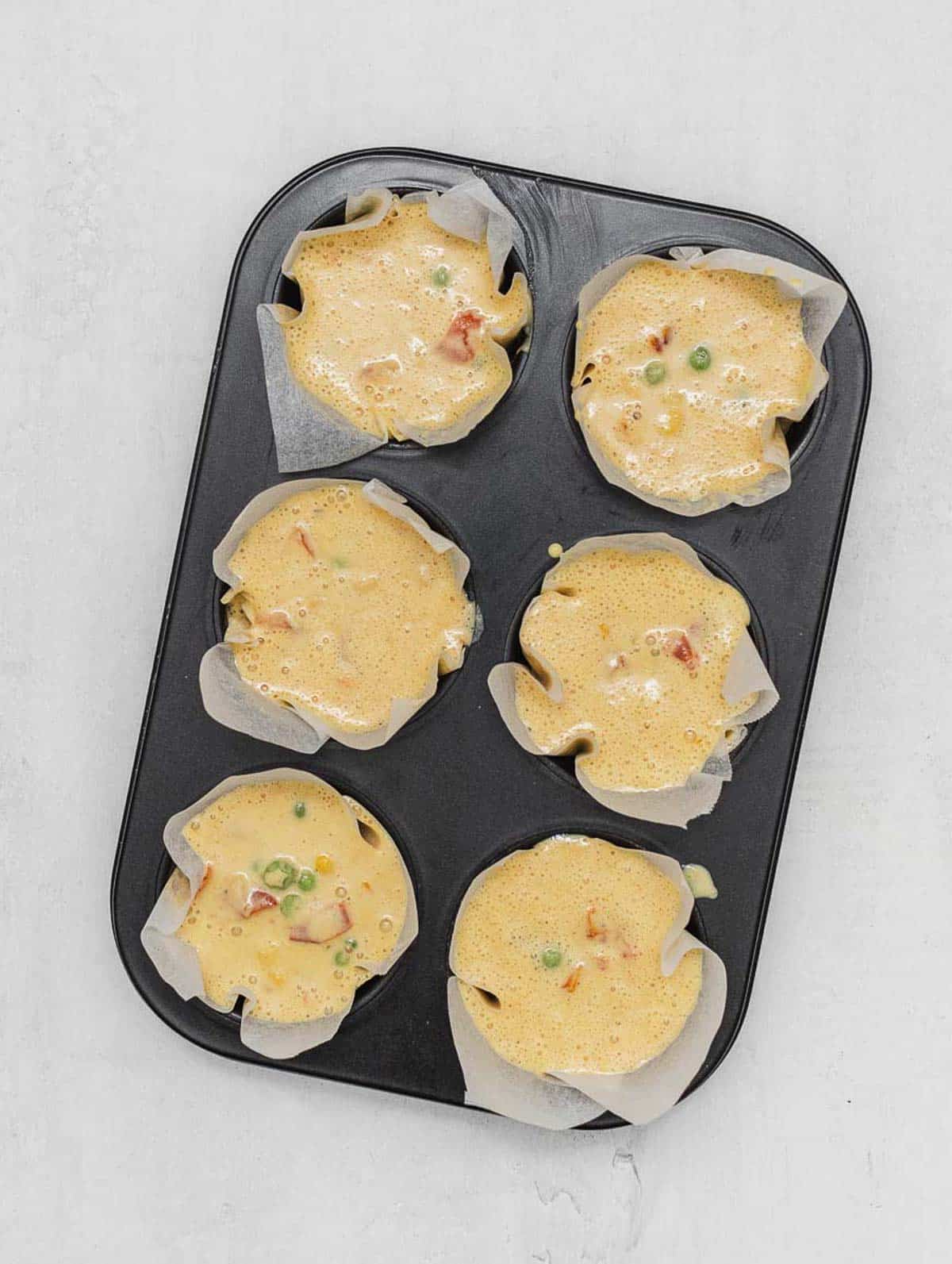 chickpea frittata muffins raw in the muffin pan