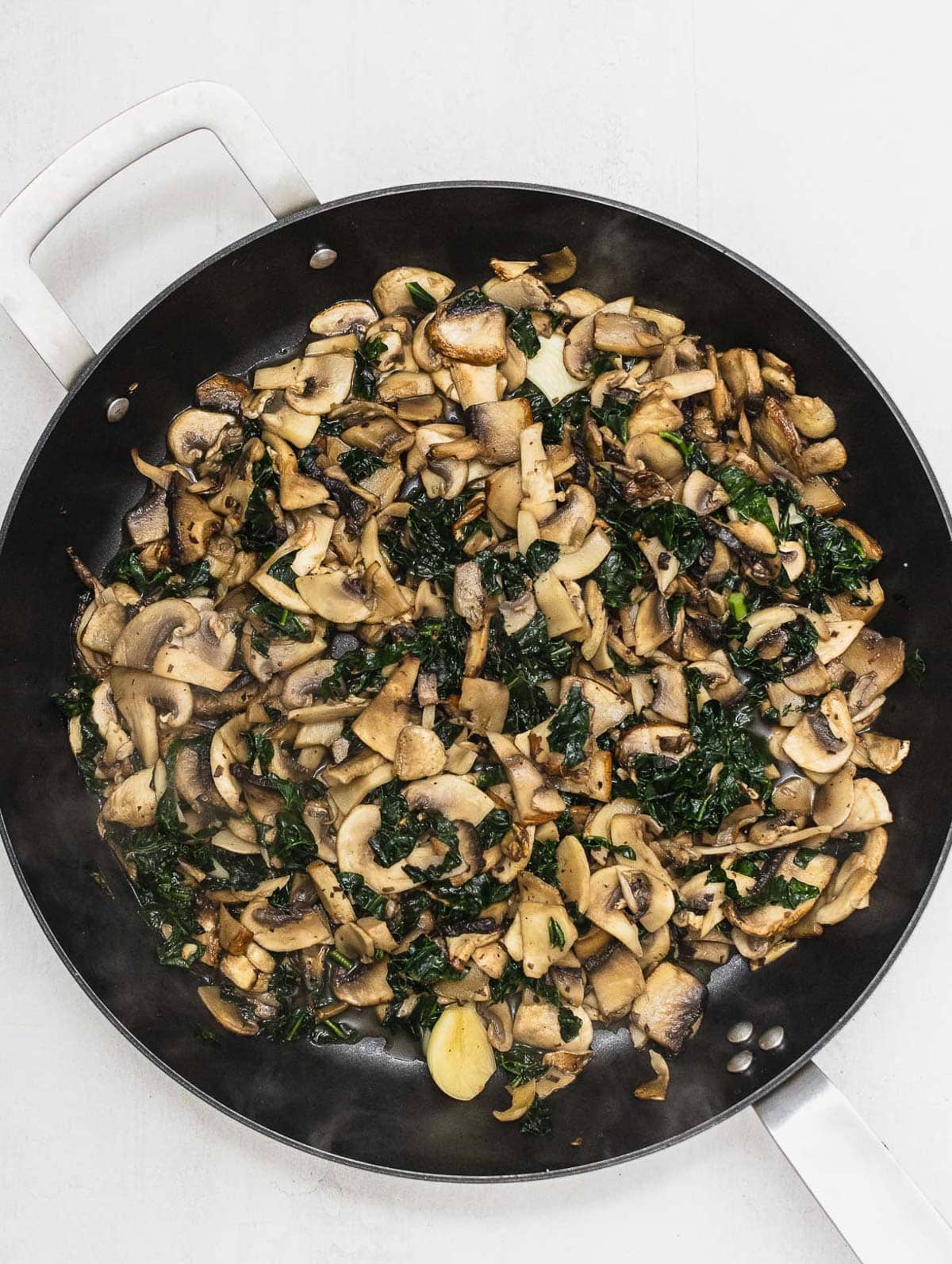 cooked mushrooms and kale for crepe filling