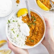 lentil curry and hands