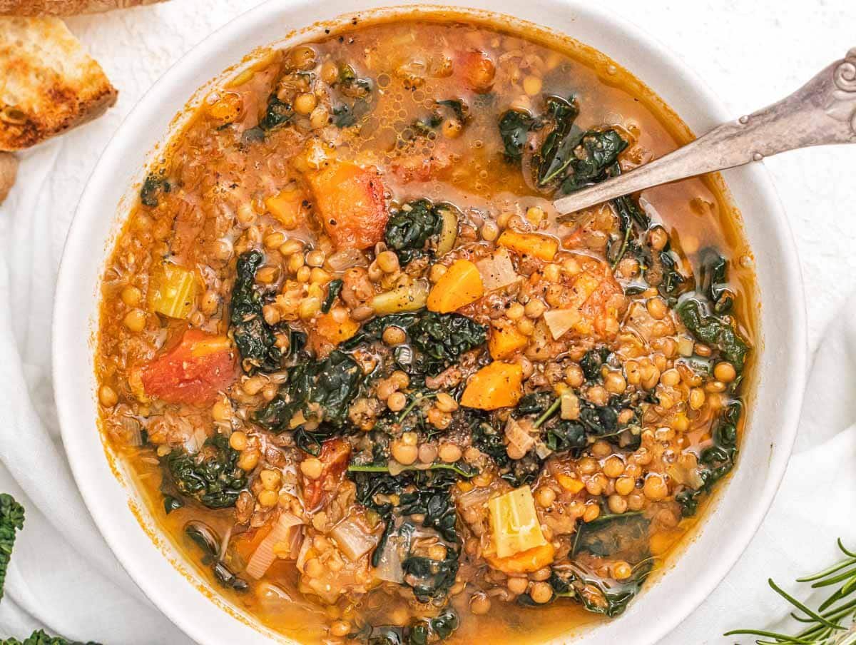 Lentil soup with spoon and bread