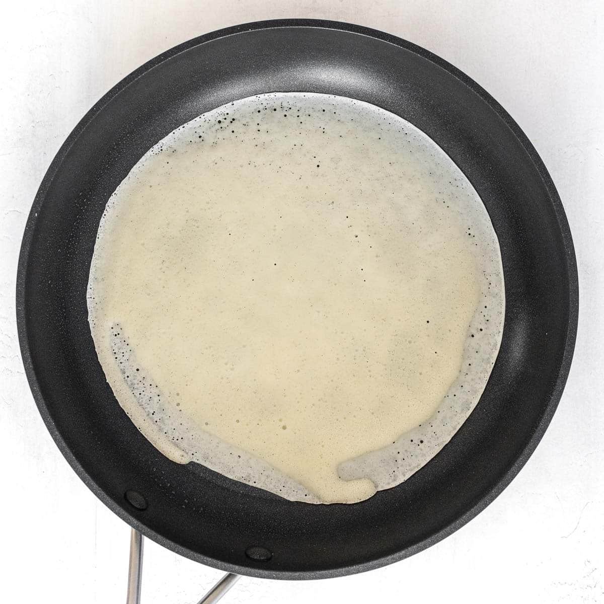 crepe cooking on a pan