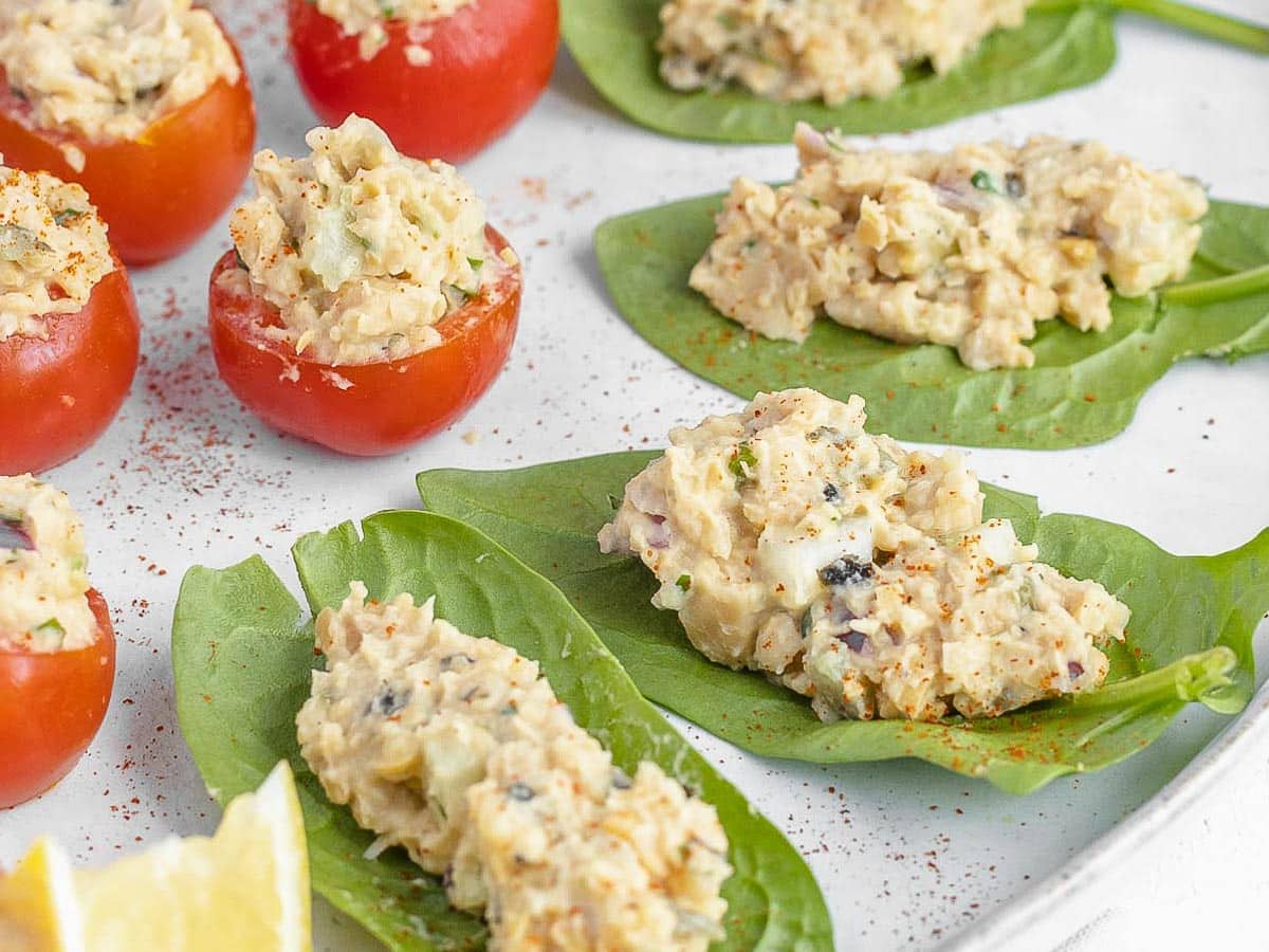 tomatoes and lettuce leaves filled with vegan tuna
