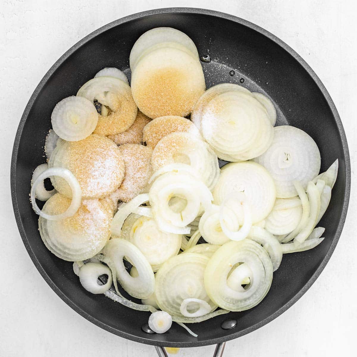 onions on a pan with sugar and oil