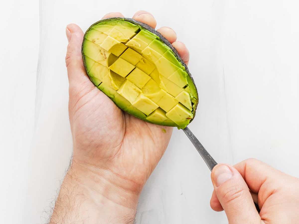 scooping out avocado