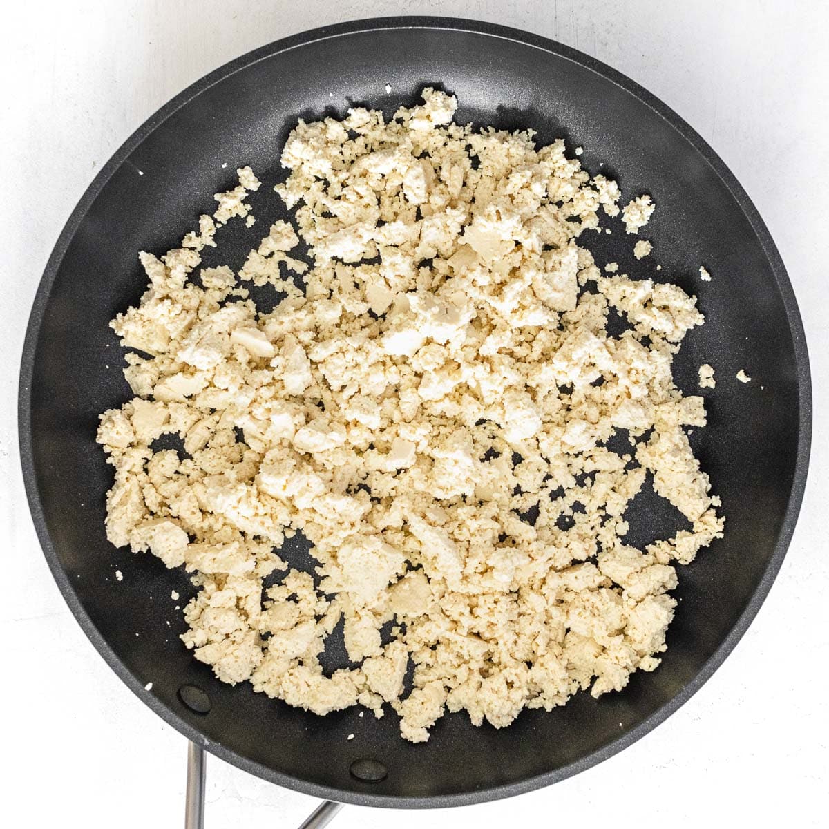 tofu crumbled on a pan