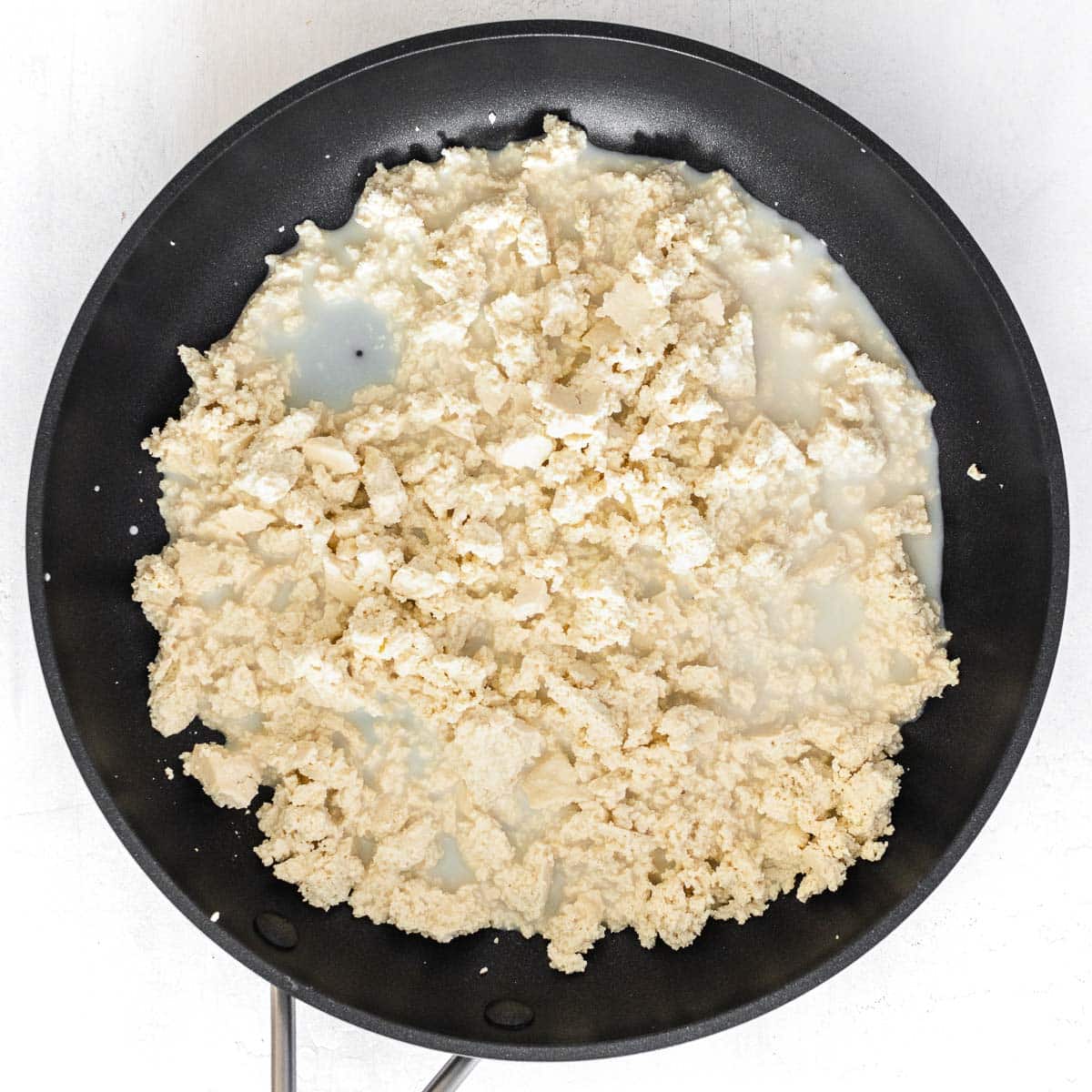 plant milk added to the crumbled tofu