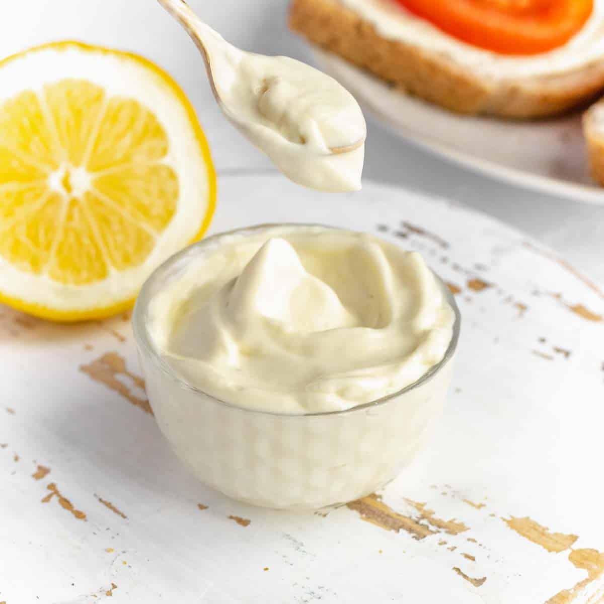 thick and creamy vegan mayo on a spoon