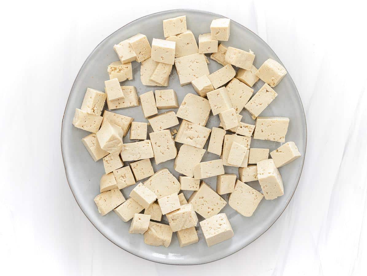 frozen and thawed tofu cubes on a plate