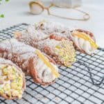 vegan cannoli topped with crushed pistachios