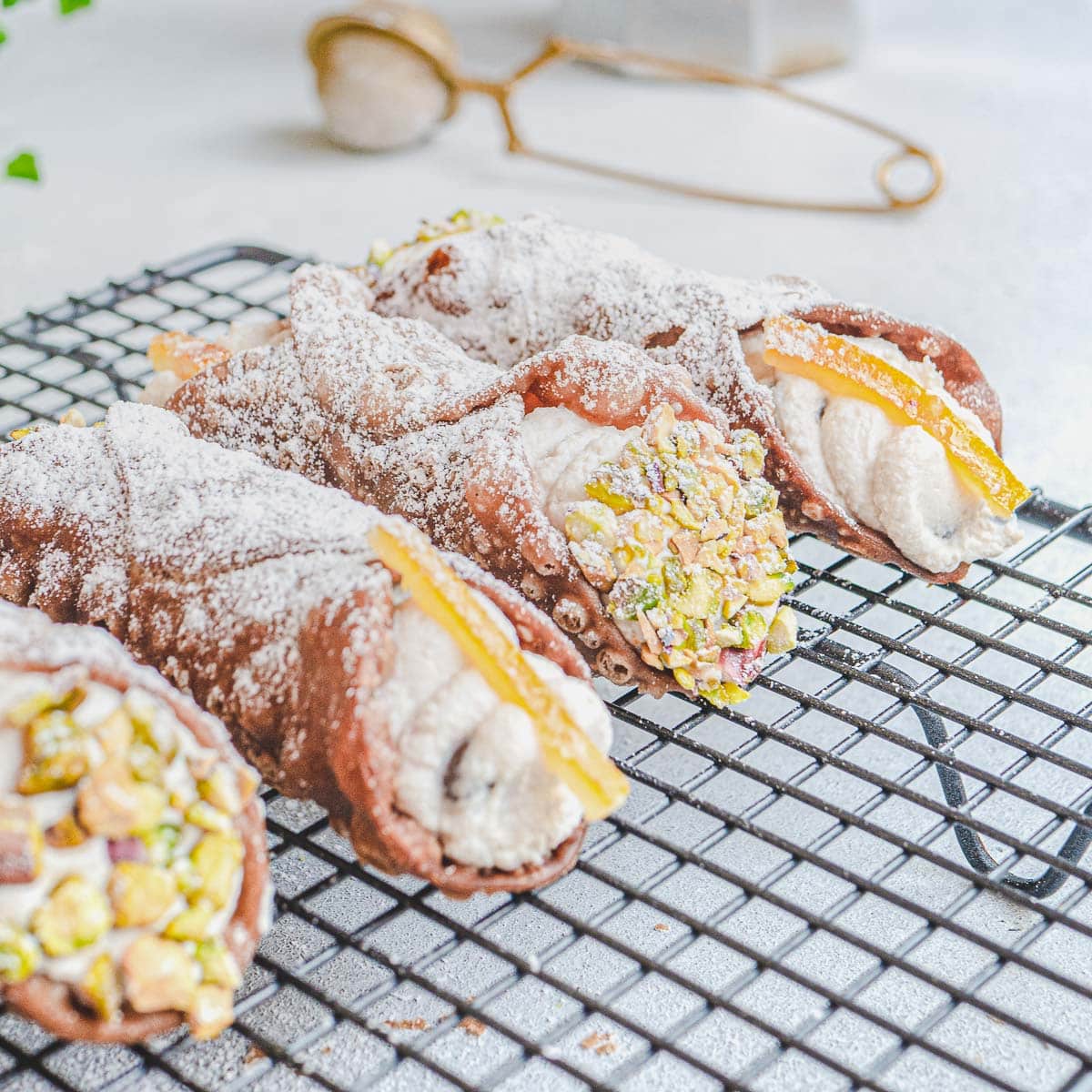 vegan cannoli topped with crushed pistachios